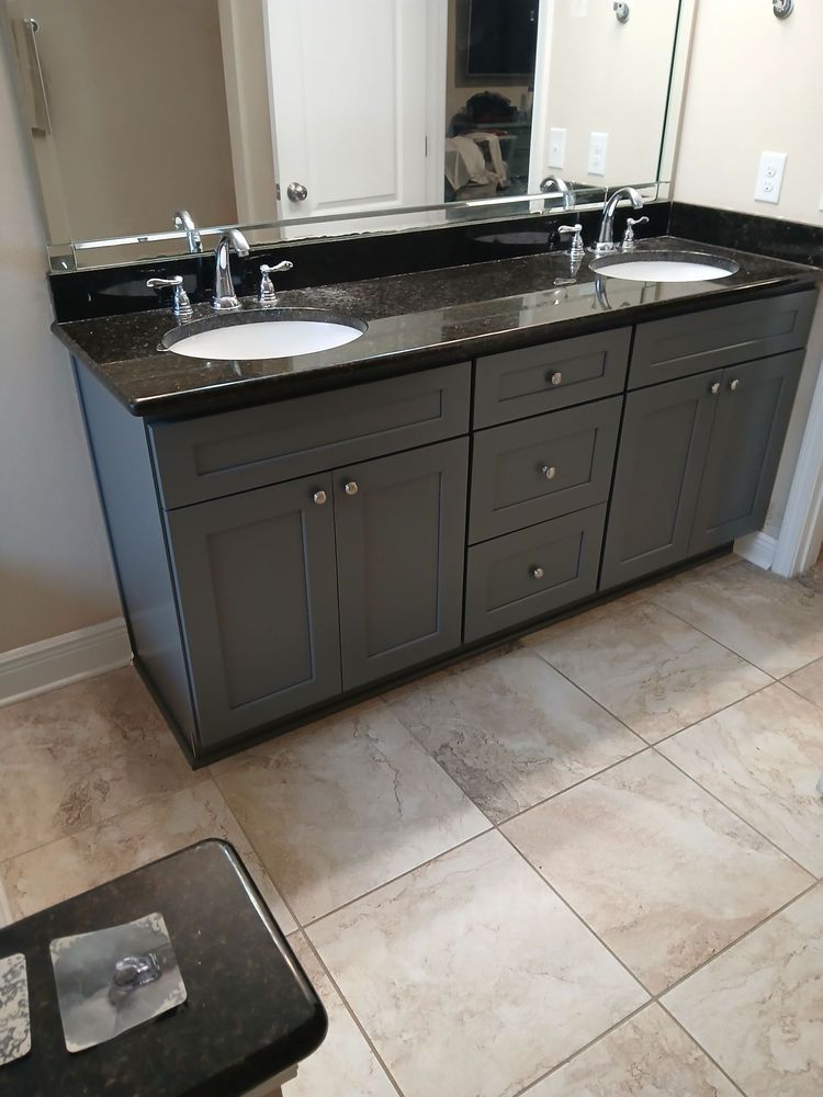 Double vanity — gray shaker cabinets, black granite, chrome fixtures